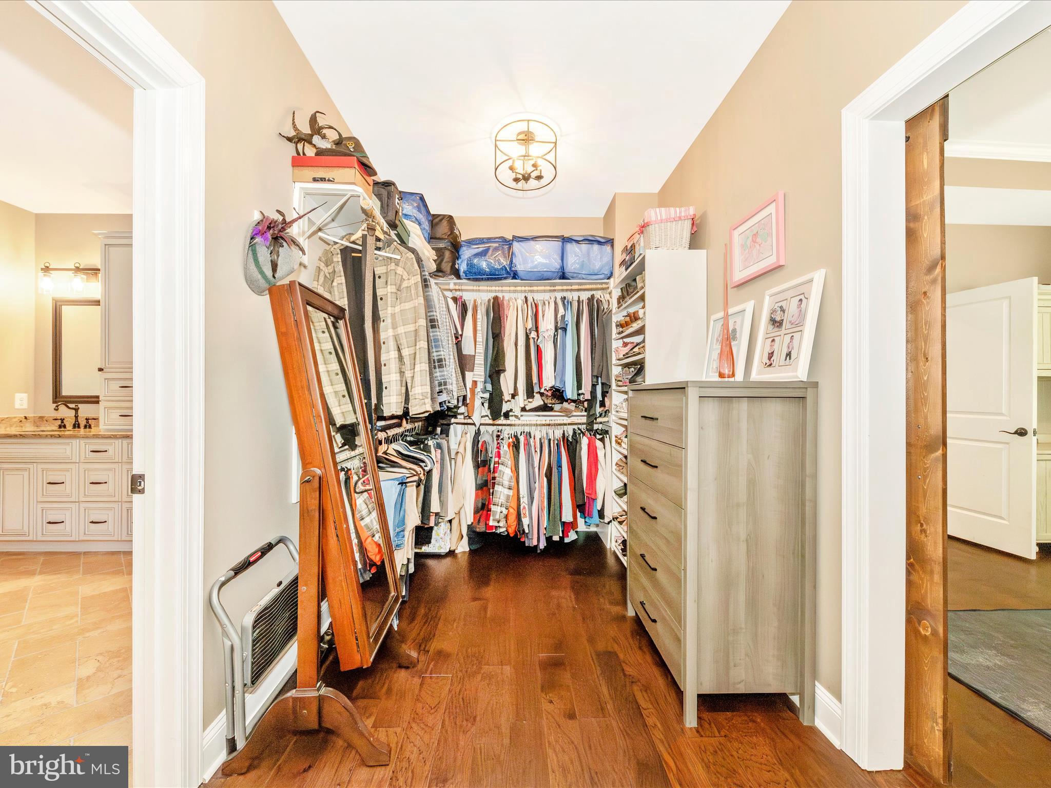 7788 Old Receiver Road Frederick, MD 21702 - Photo 22 of 51 a view of walk in closet with clothes and shoes