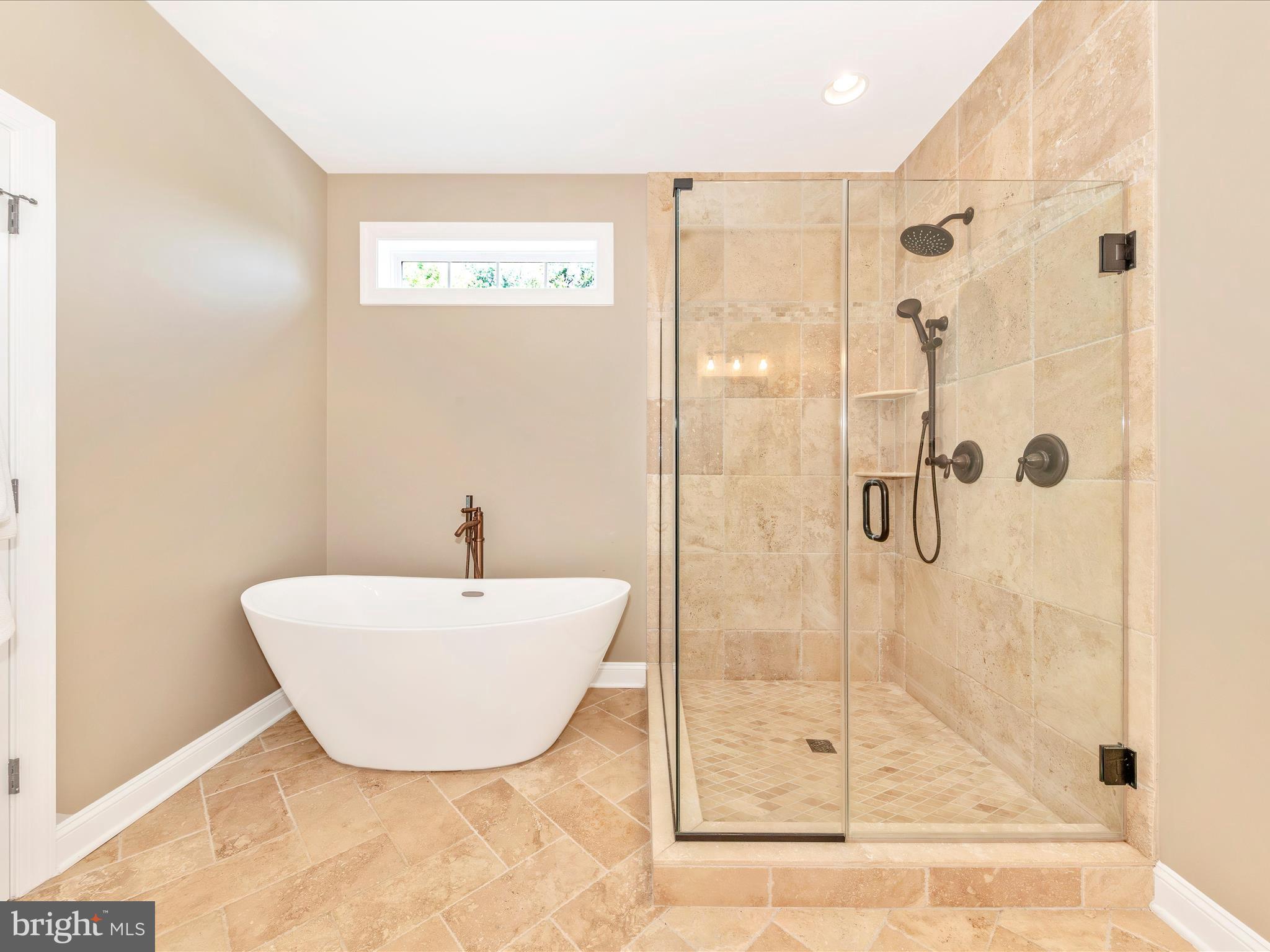 7788 Old Receiver Road Frederick, MD 21702 - Photo 24 of 51 a bathroom with a bathtub and shower