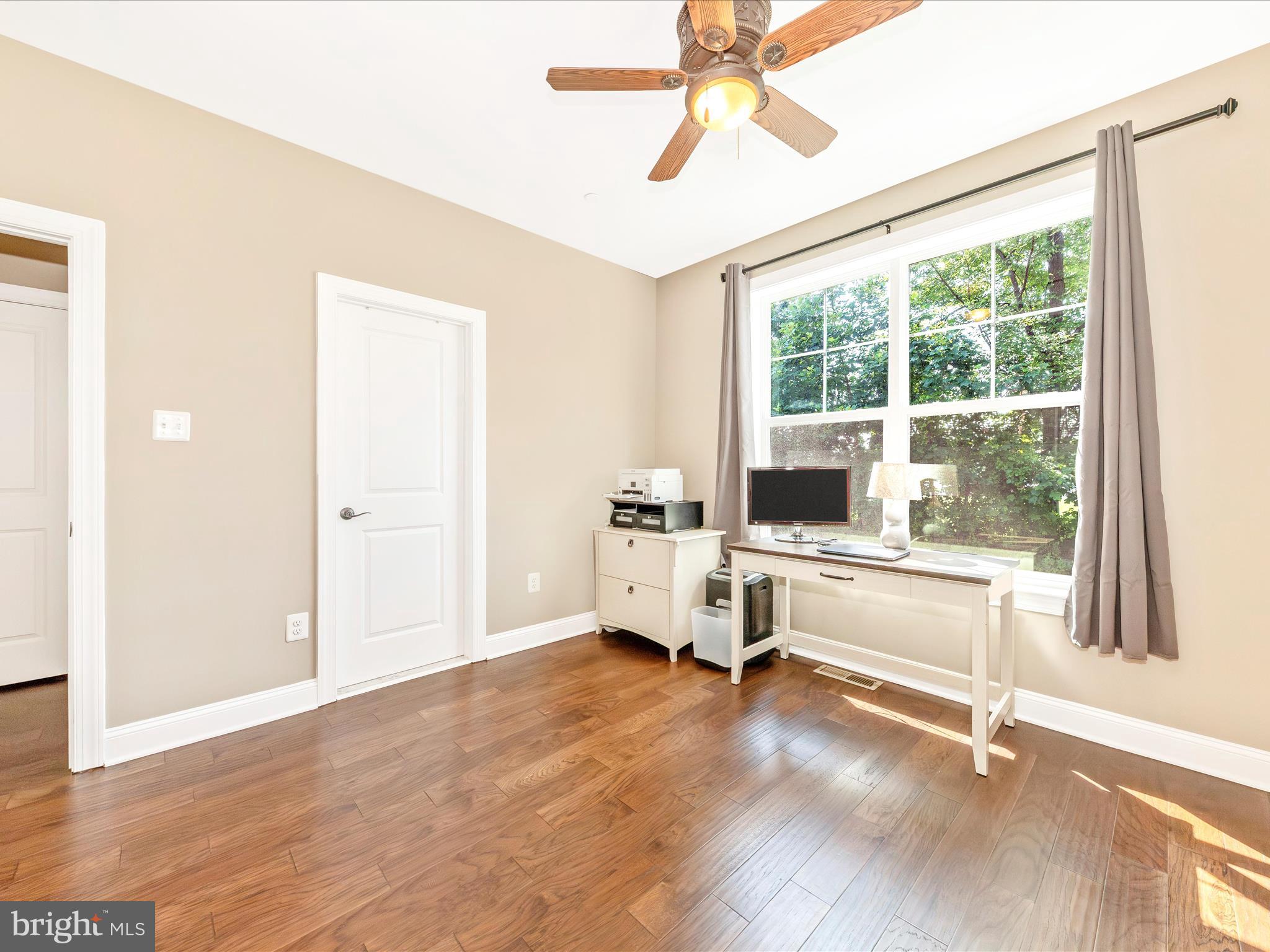 7788 Old Receiver Road Frederick, MD 21702 - Photo 29 of 51 a view of a livingroom with furniture a flat screen tv and wooden floor