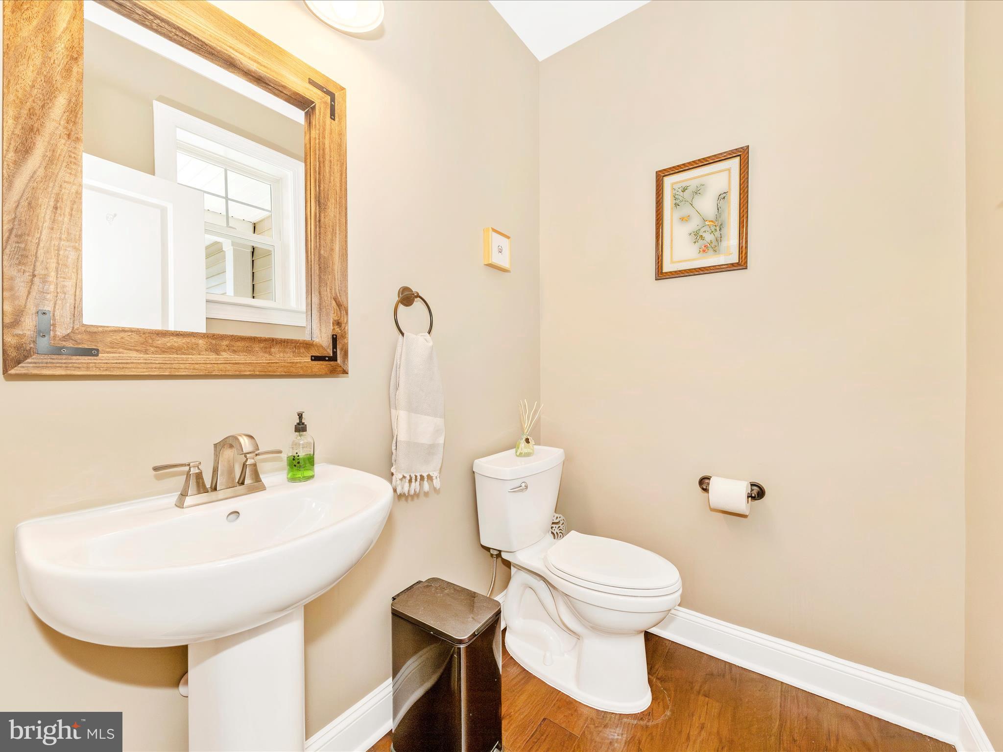 7788 Old Receiver Road Frederick, MD 21702 - Photo 33 of 51 a bathroom with a toilet sink and mirror