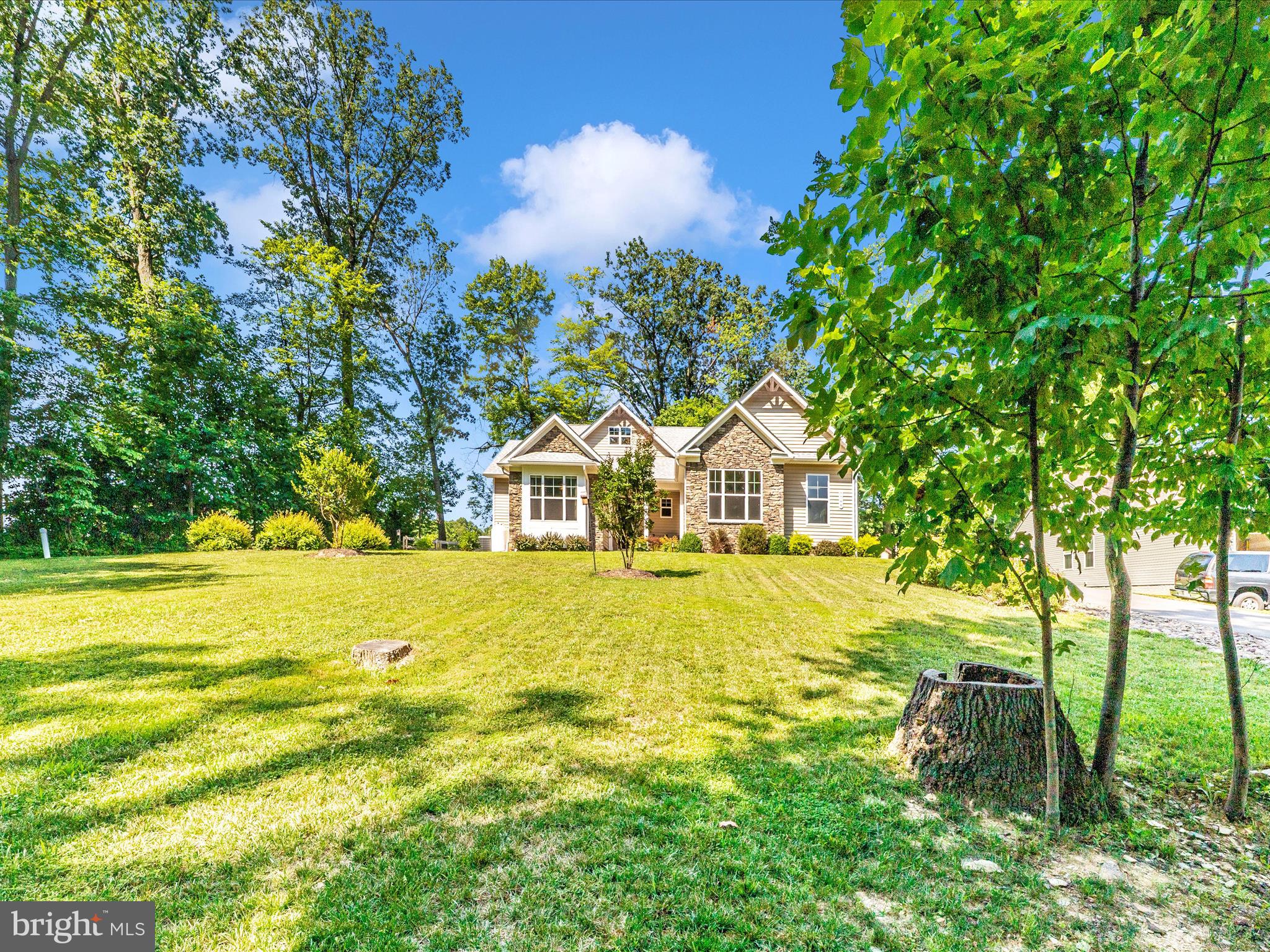 7788 Old Receiver Road Frederick, MD 21702 - Photo 4 of 51 a yellow house with swimming pool in front of it
