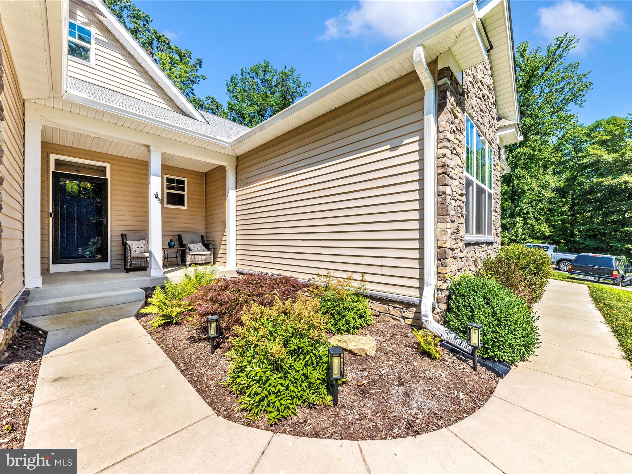 7788 Old Receiver Road Frederick, MD 21702 - Photo 6 of 51 a view of a backyard with plants and seating space