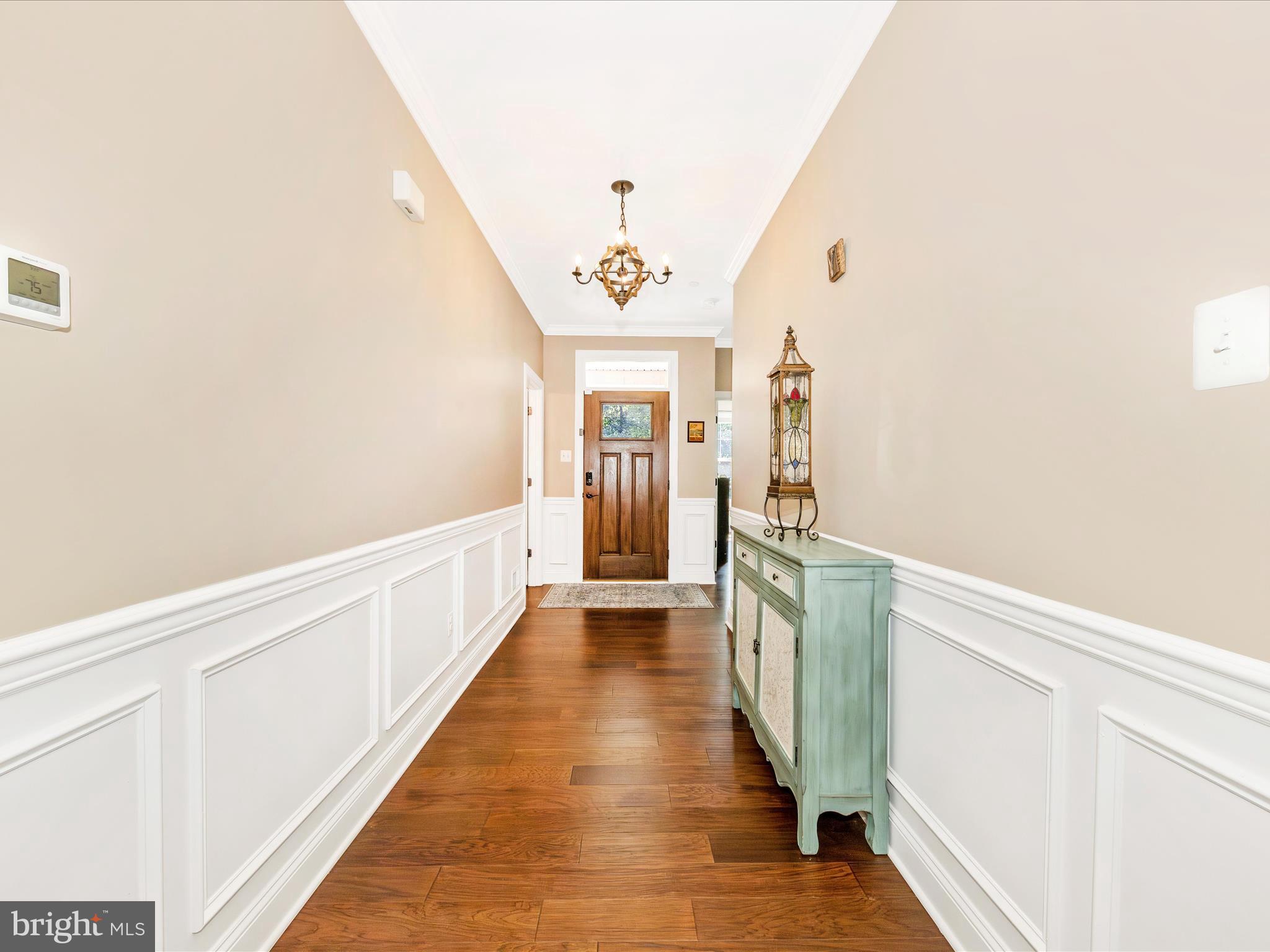 7788 Old Receiver Road Frederick, MD 21702 - Photo 9 of 51 a view of a hallway view with wooden floor and staircase