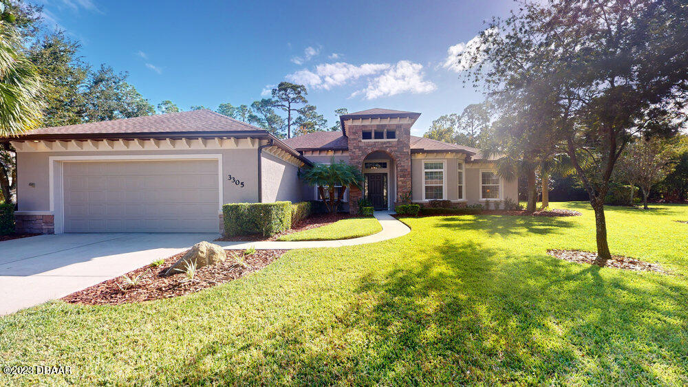 a view of a house with swimming pool and yard