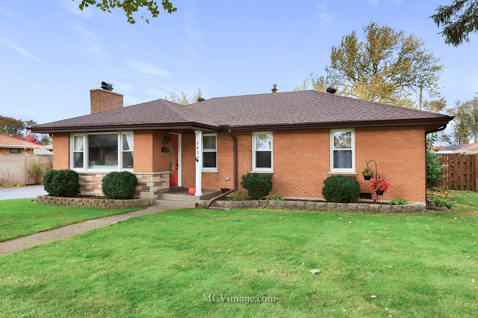 5830 108th Place Chicago Ridge, IL 60415 - Photo 1 of 28 a front view of a house with a yard and garage