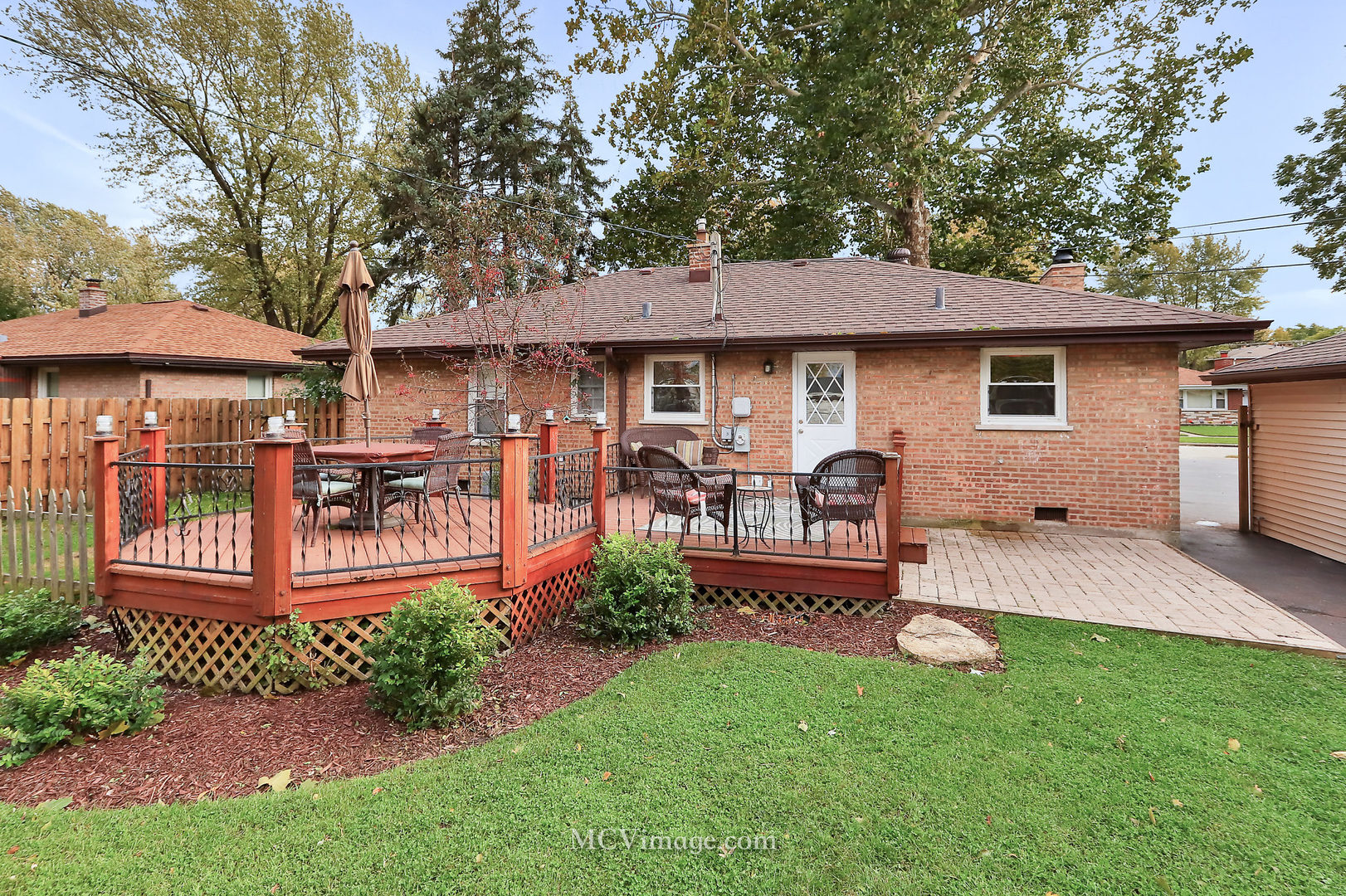 5830 108th Place Chicago Ridge, IL 60415 - Photo 28 of 28 a front view of a house with garden and sitting area
