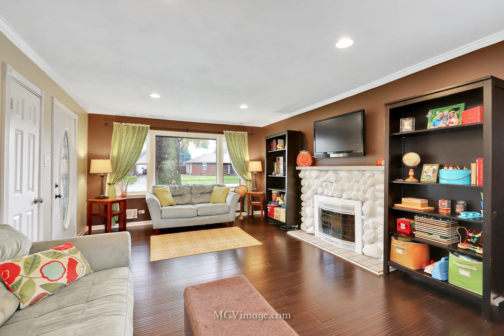 5830 108th Place Chicago Ridge, IL 60415 - Photo 9 of 28 a living room with fireplace furniture and a flat screen tv