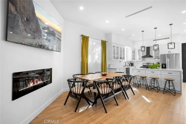 a dining room with furniture and a fireplace