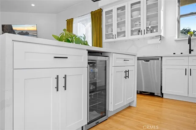 a shelf with books and knick knacks on it