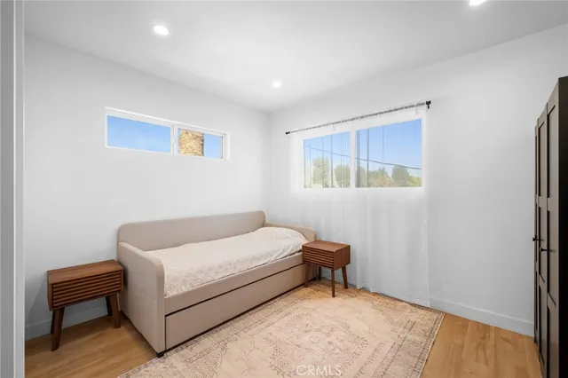 a bedroom with a bed and a painting