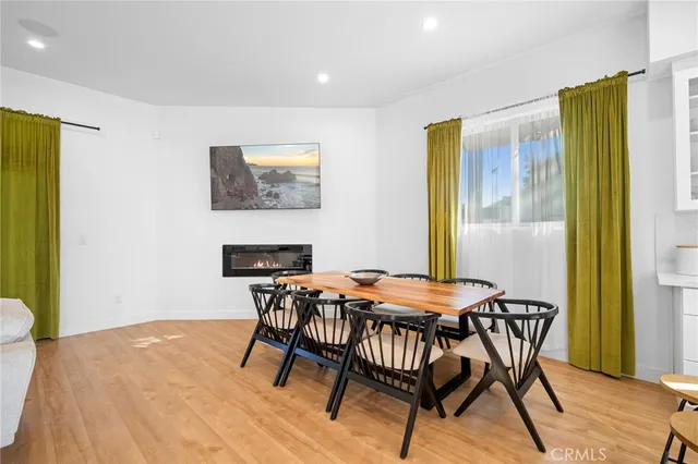 a dining room with furniture and a fireplace