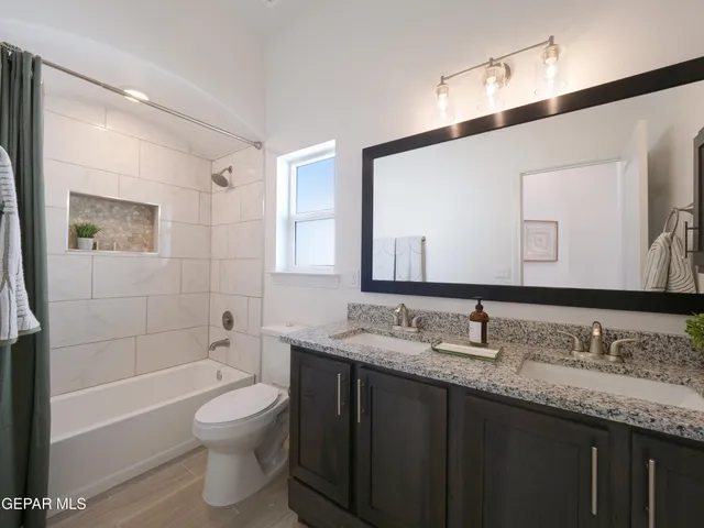 a view of a workspace with furniture and a potted plant