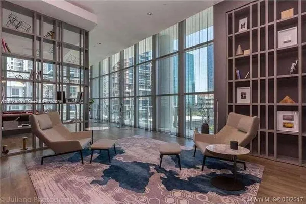 a view of a swimming pool and a yard