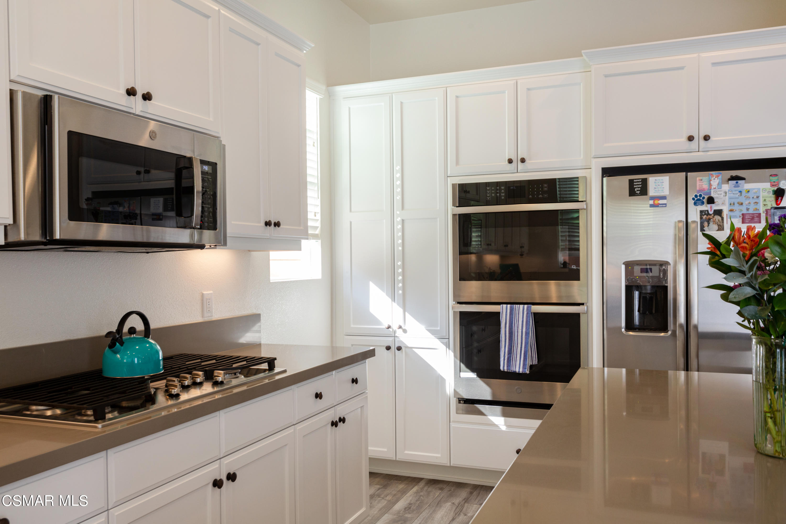 1620 Range Road Oxnard, CA 93036 - Photo 11 of 34 a kitchen with stainless steel appliances granite countertop a stove a microwave and cabinets