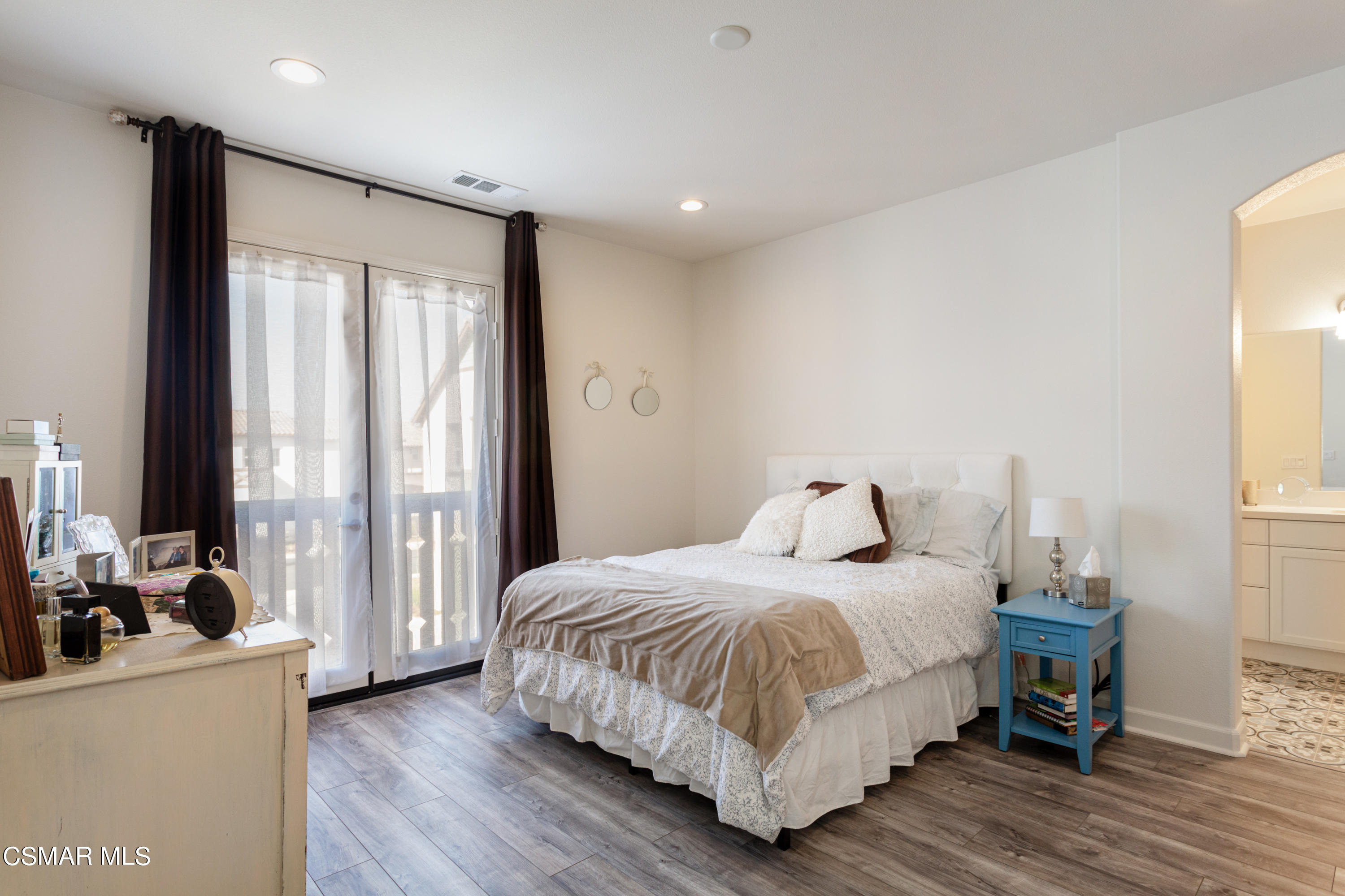 1620 Range Road Oxnard, CA 93036 - Photo 14 of 34 a bedroom with a bed and wooden floor