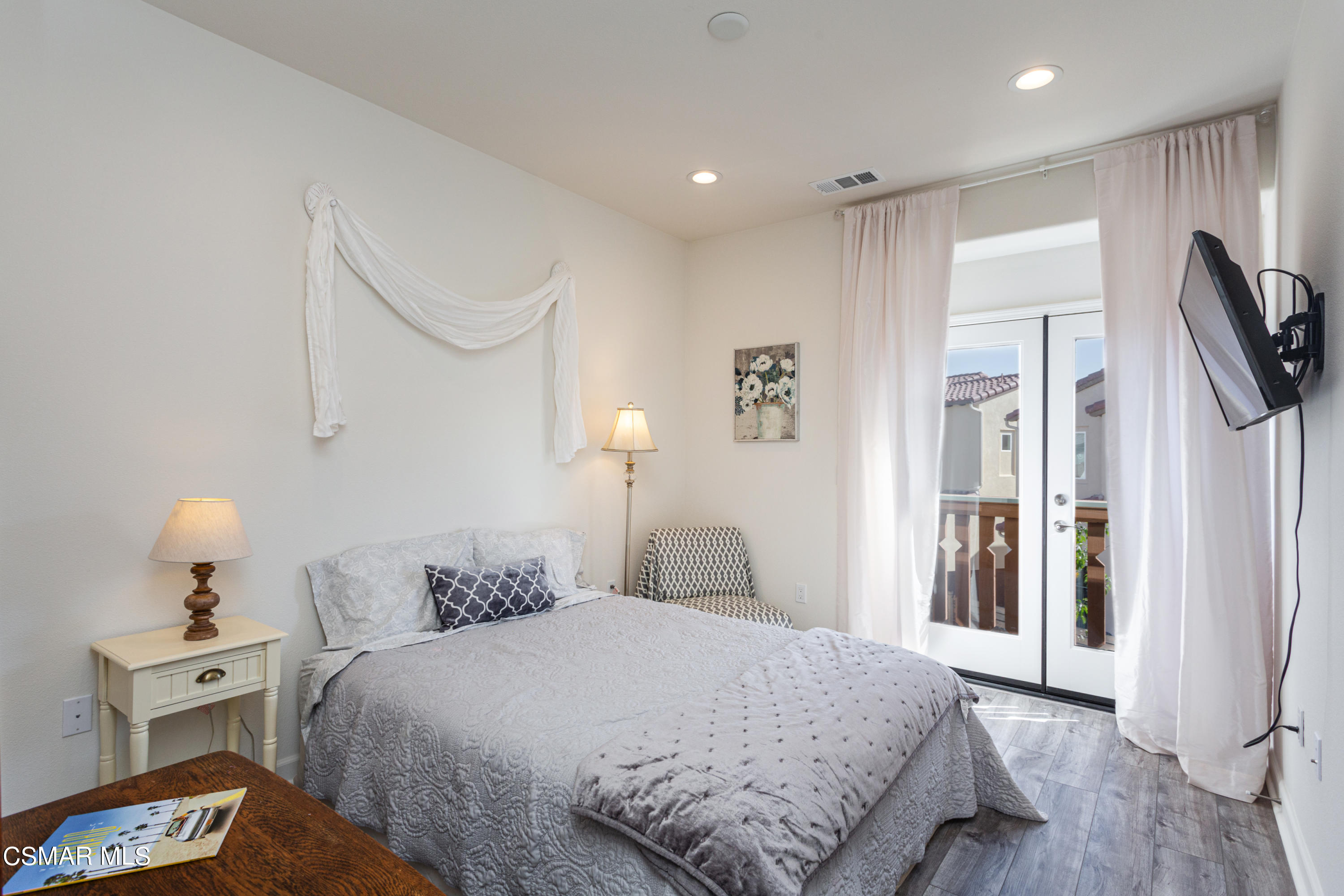 1620 Range Road Oxnard, CA 93036 - Photo 18 of 34 a bedroom with a bed and a refrigerator