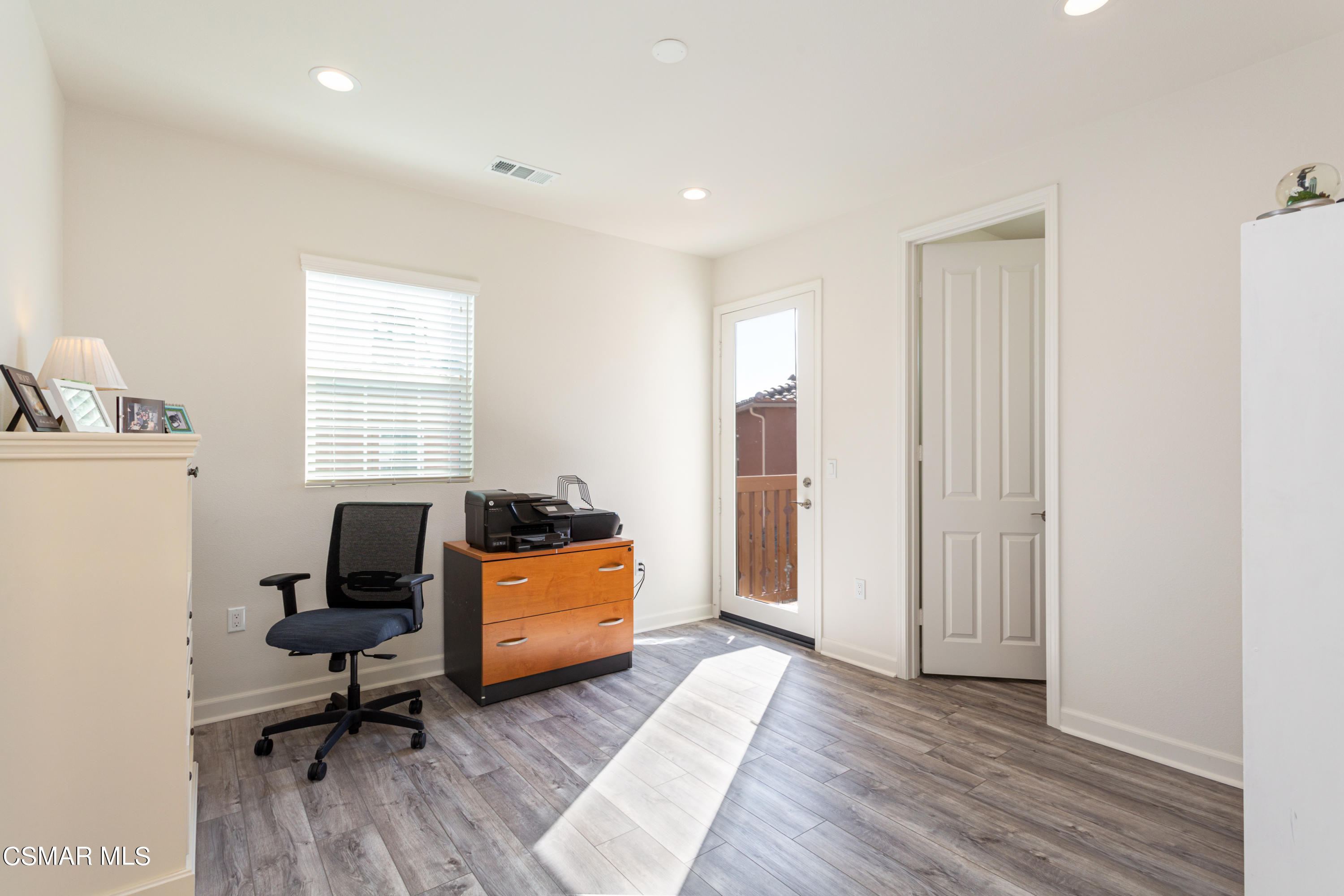 1620 Range Road Oxnard, CA 93036 - Photo 22 of 34 a view of a workspace with furniture and a window