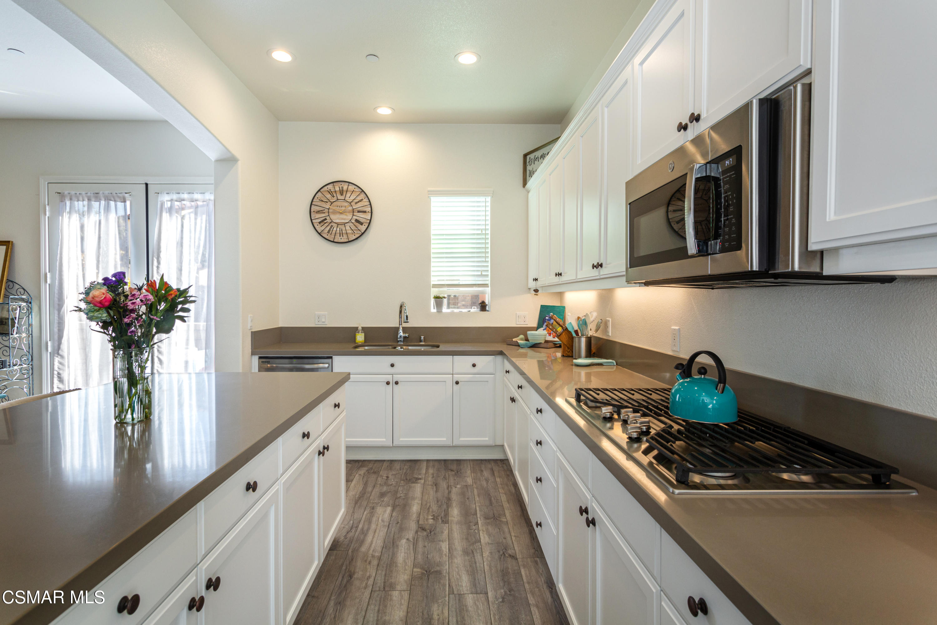 1620 Range Road Oxnard, CA 93036 - Photo 10 of 34 a kitchen with a sink stove and microwave