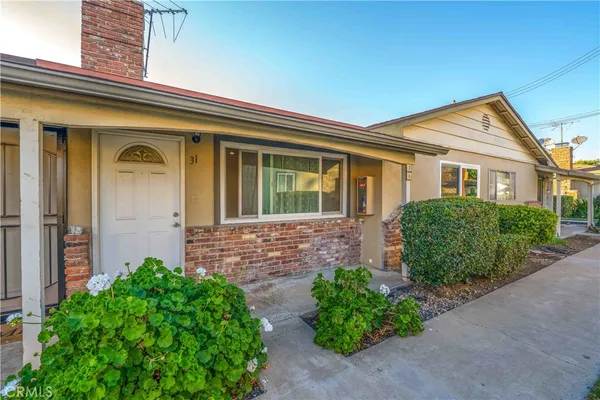 front view of a house with a small yard