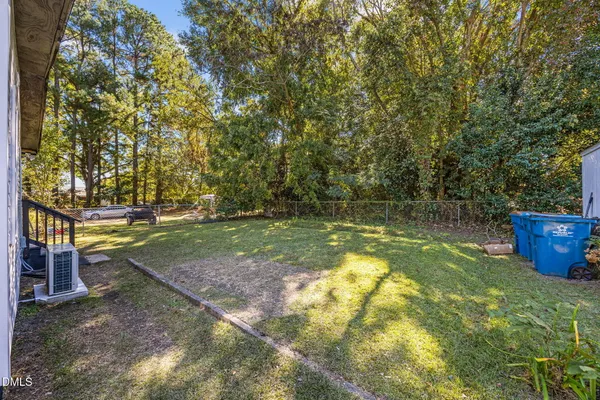 a kitchen with a refrigerator sink and stove top oven