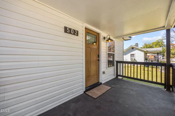 a view of house with outdoor seating