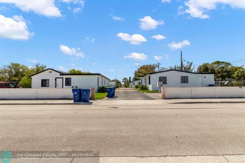 3039 Avenue J, Unit 6 Riviera Beach, FL 33404 - Photo 1 of 21 a view of a house with a street