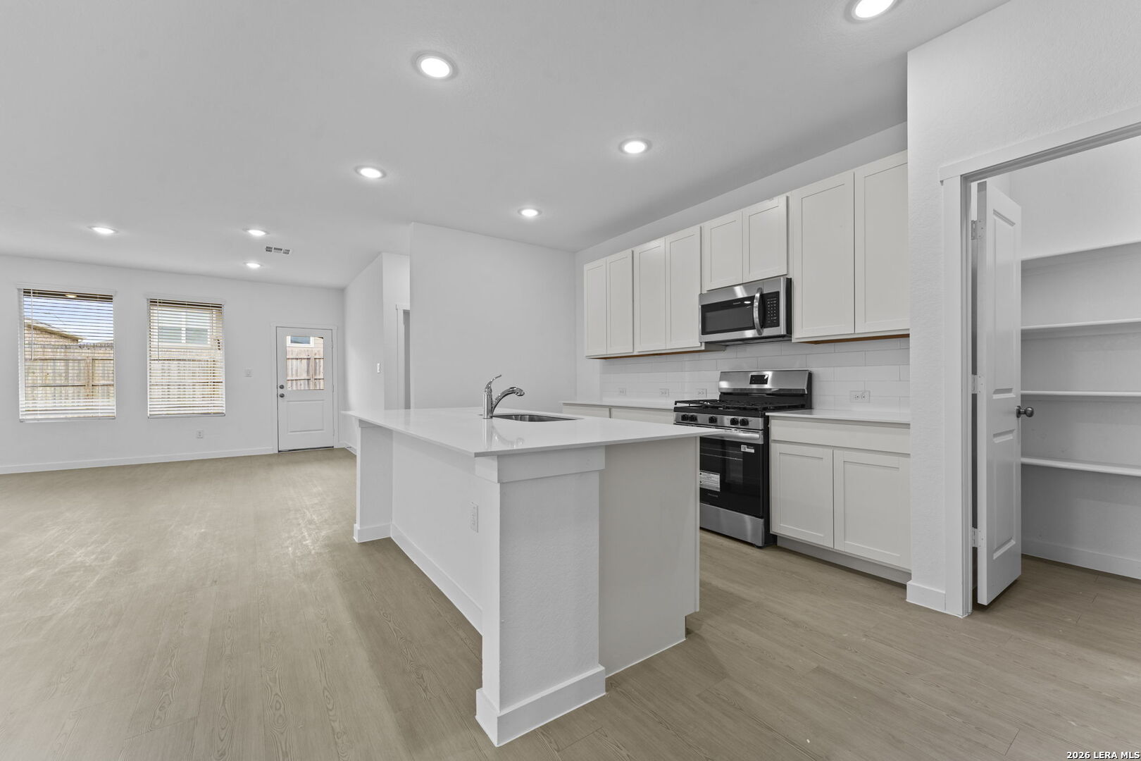2307 Fort Davis Pass Marion, TX 78124 - Photo 17 of 31 a kitchen with white cabinets and appliances