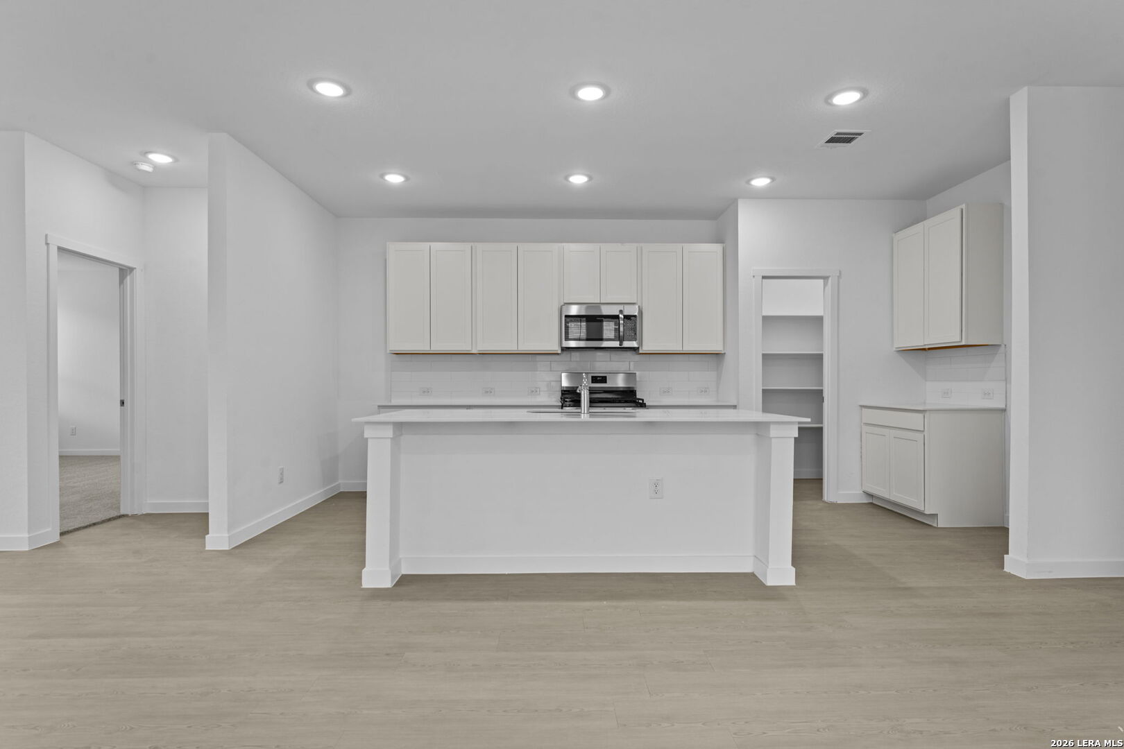 2307 Fort Davis Pass Marion, TX 78124 - Photo 18 of 31 a view of kitchen with granite countertop white cabinets and stainless steel appliances