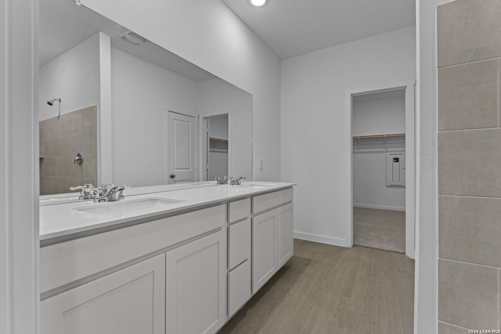 2307 Fort Davis Pass Marion, TX 78124 - Photo 28 of 31 a bathroom with a double vanity sink and mirror