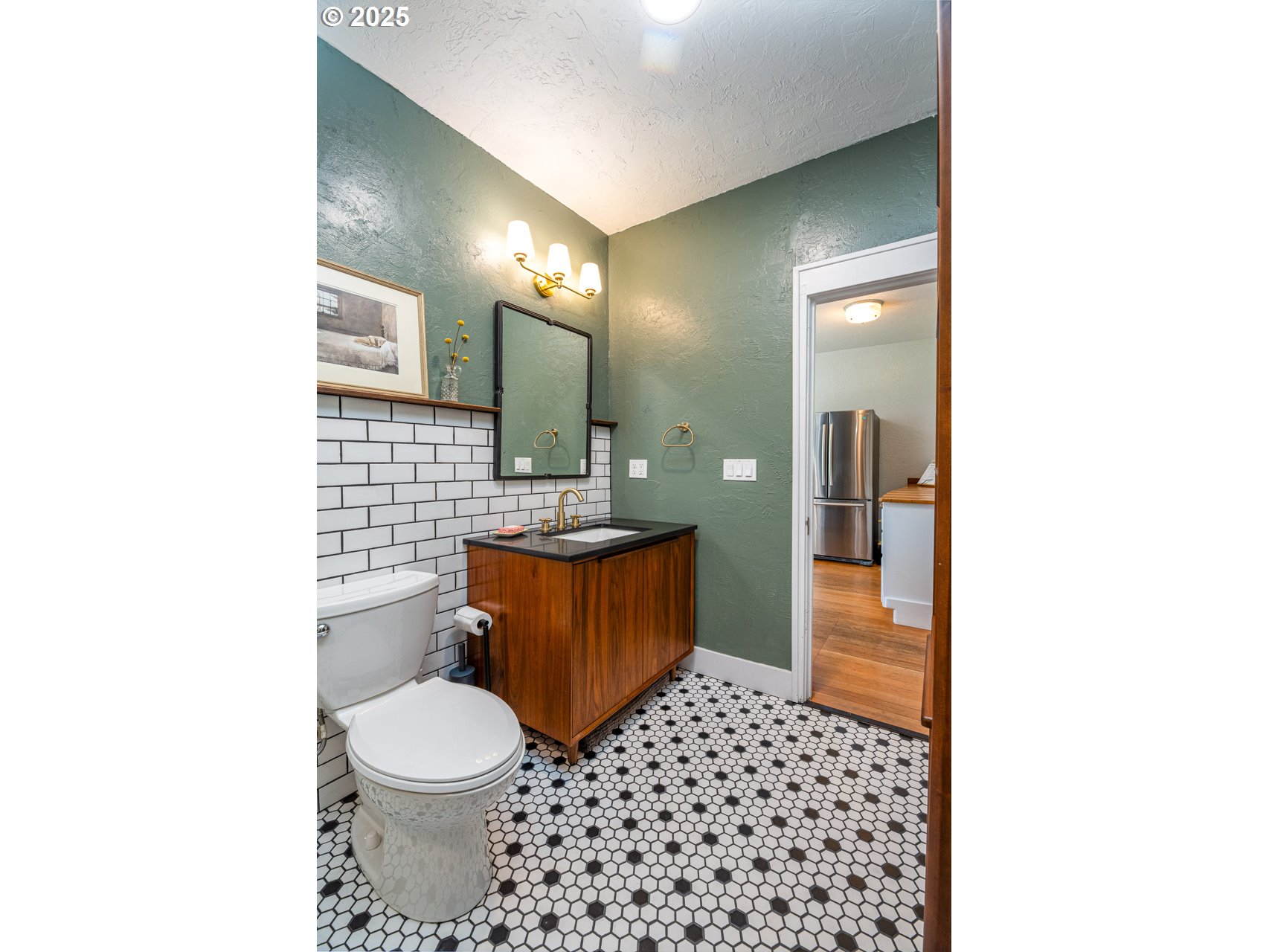 945 B Street Springfield, OR 97477 - Photo 24 of 35 a bathroom with a toilet a sink and a mirror