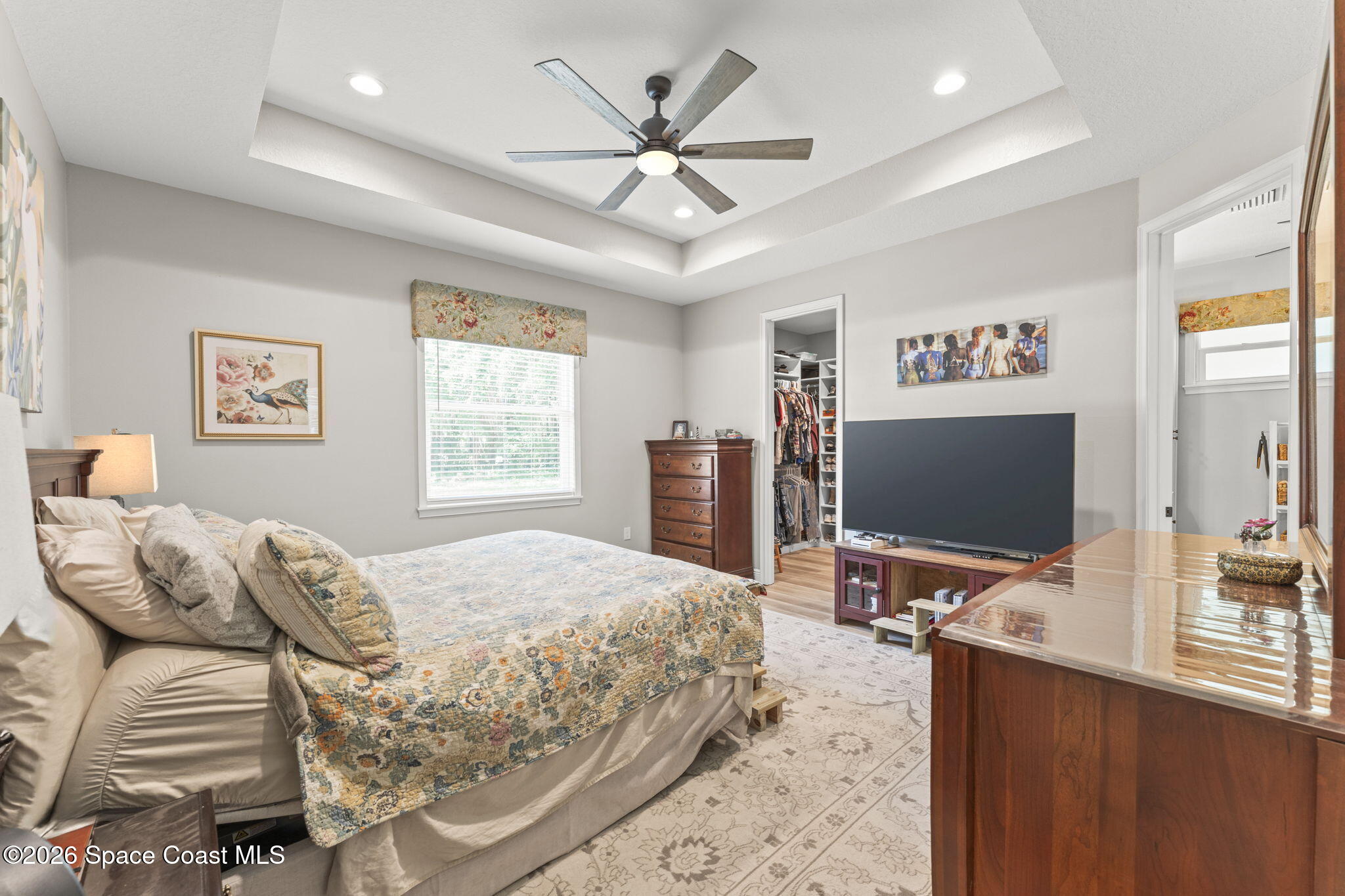 1740 Ford Road Mims, FL 32754 - Photo 22 of 43 a bedroom with a bed and a flat screen tv