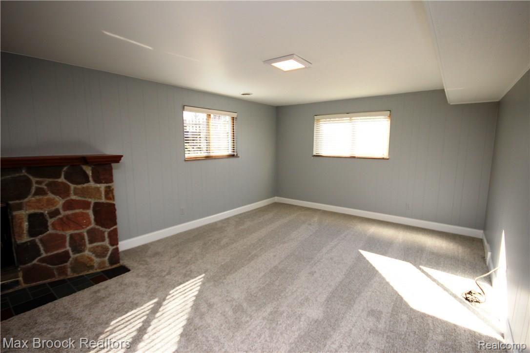 3770 Beach Road Troy, MI 48084 - Photo 17 of 31 Family room also features plenty of windows and natural fireplace
