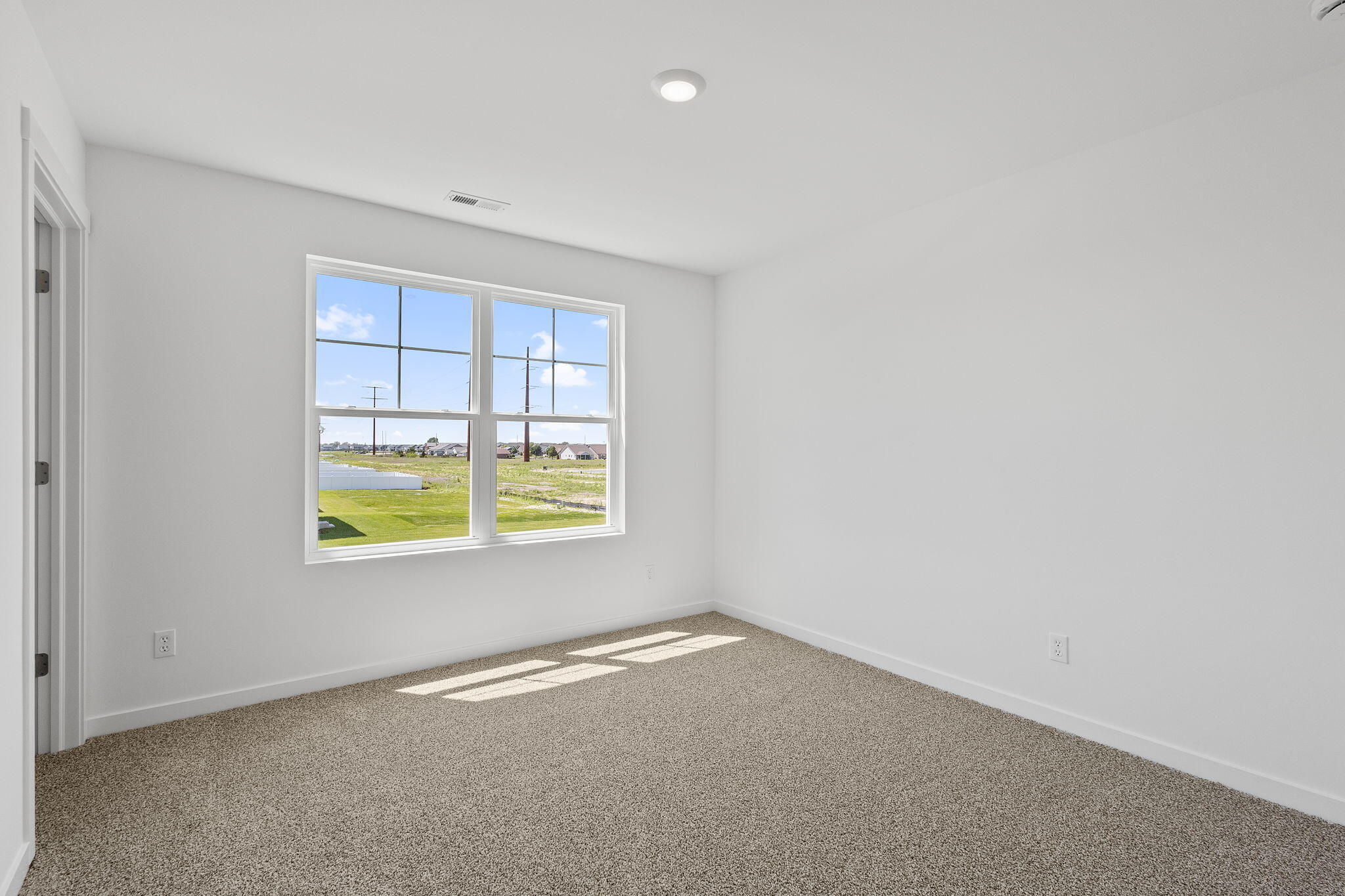 7883 West 105th Avenue Crown Point, IN 46307 - Photo 22 of 26 an empty room with a window
