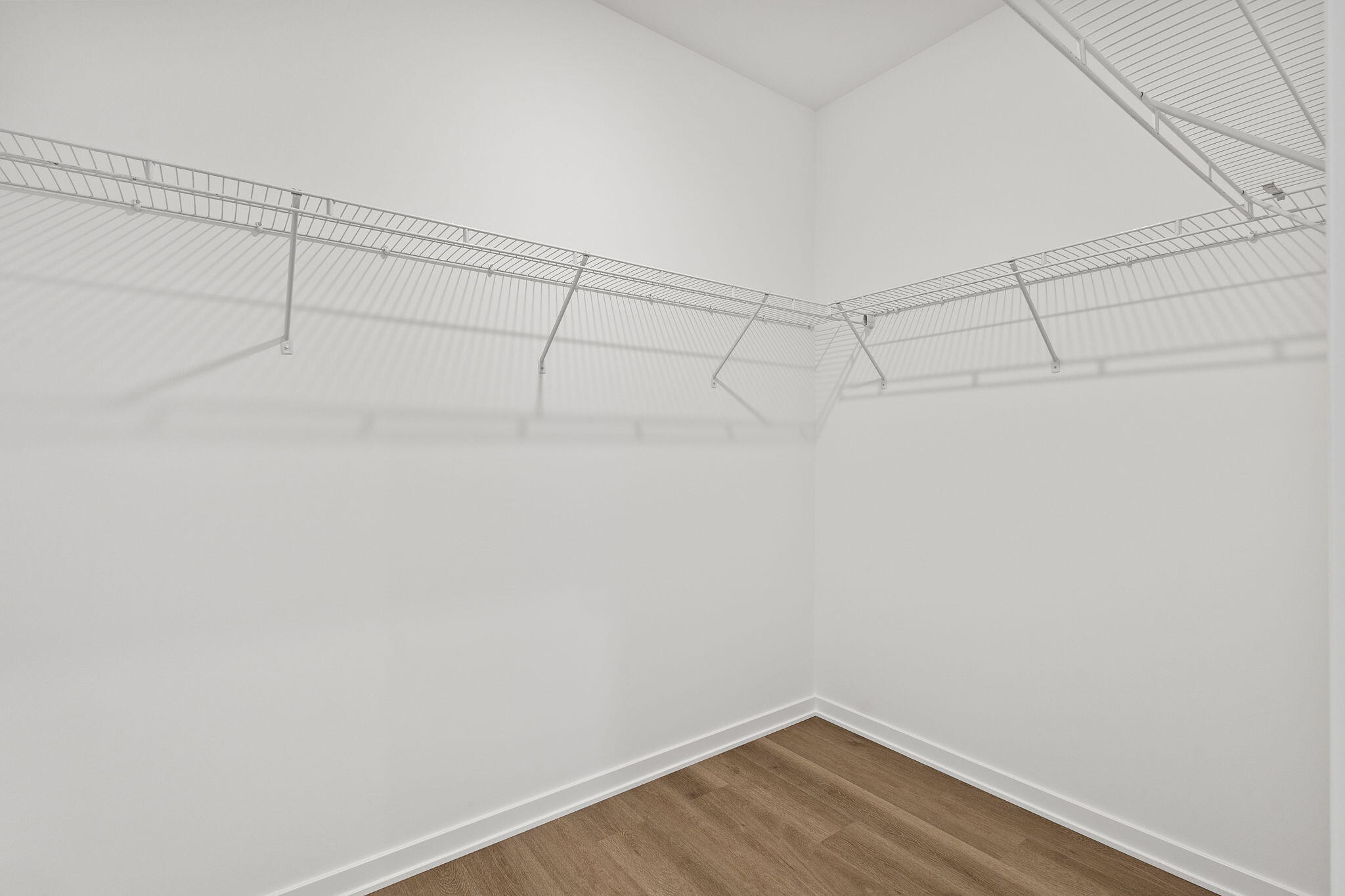 7883 West 105th Avenue Crown Point, IN 46307 - Photo 10 of 26 a view of a room with racks on the wall