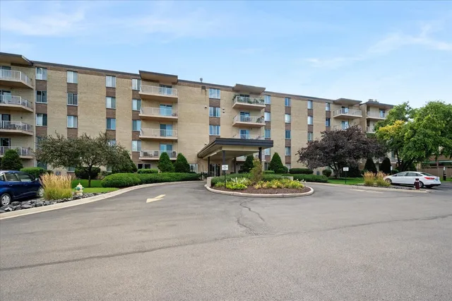 a view of a street with a cars parked in front of it