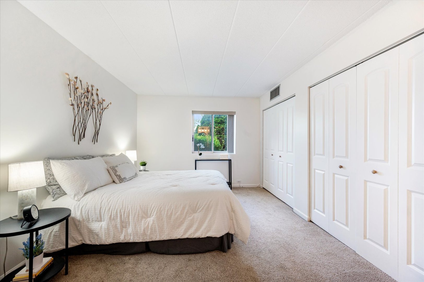 100 West Butterfield Road, Unit 101N Elmhurst, IL 60126 - Photo 12 of 27 a bedroom with a bed and a window