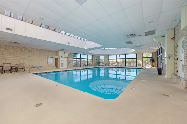a view of a living room and hall with a dining table