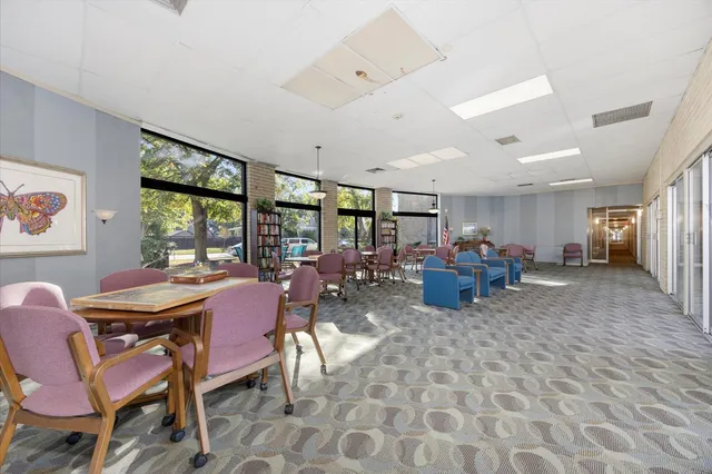 a view of a dining room with furniture window and outside view