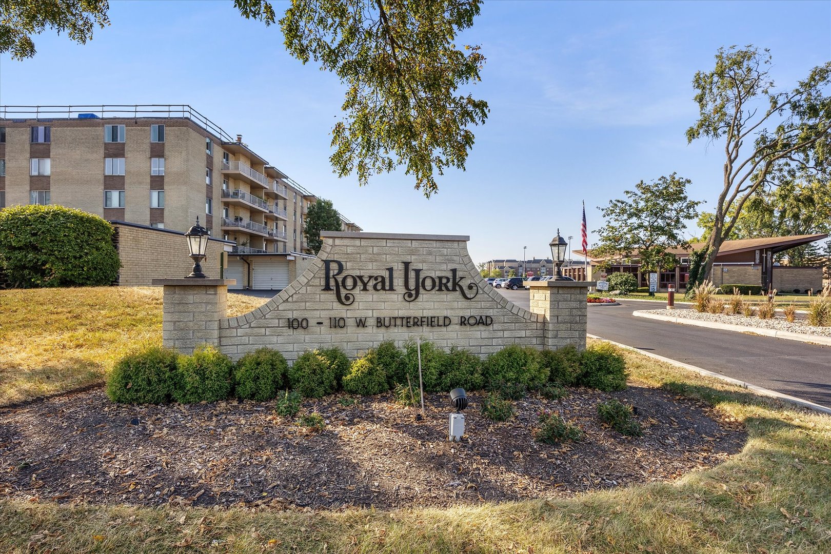 100 West Butterfield Road, Unit 101N Elmhurst, IL 60126 - Photo 26 of 27 a street sign on a sidewalk next to a road