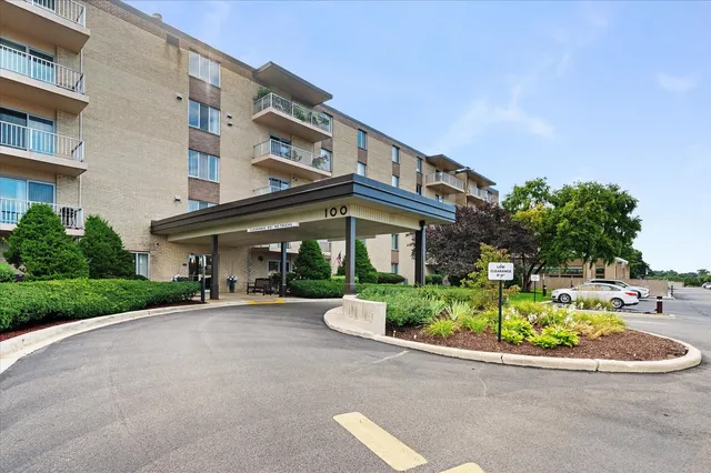 a front view of a building with garden