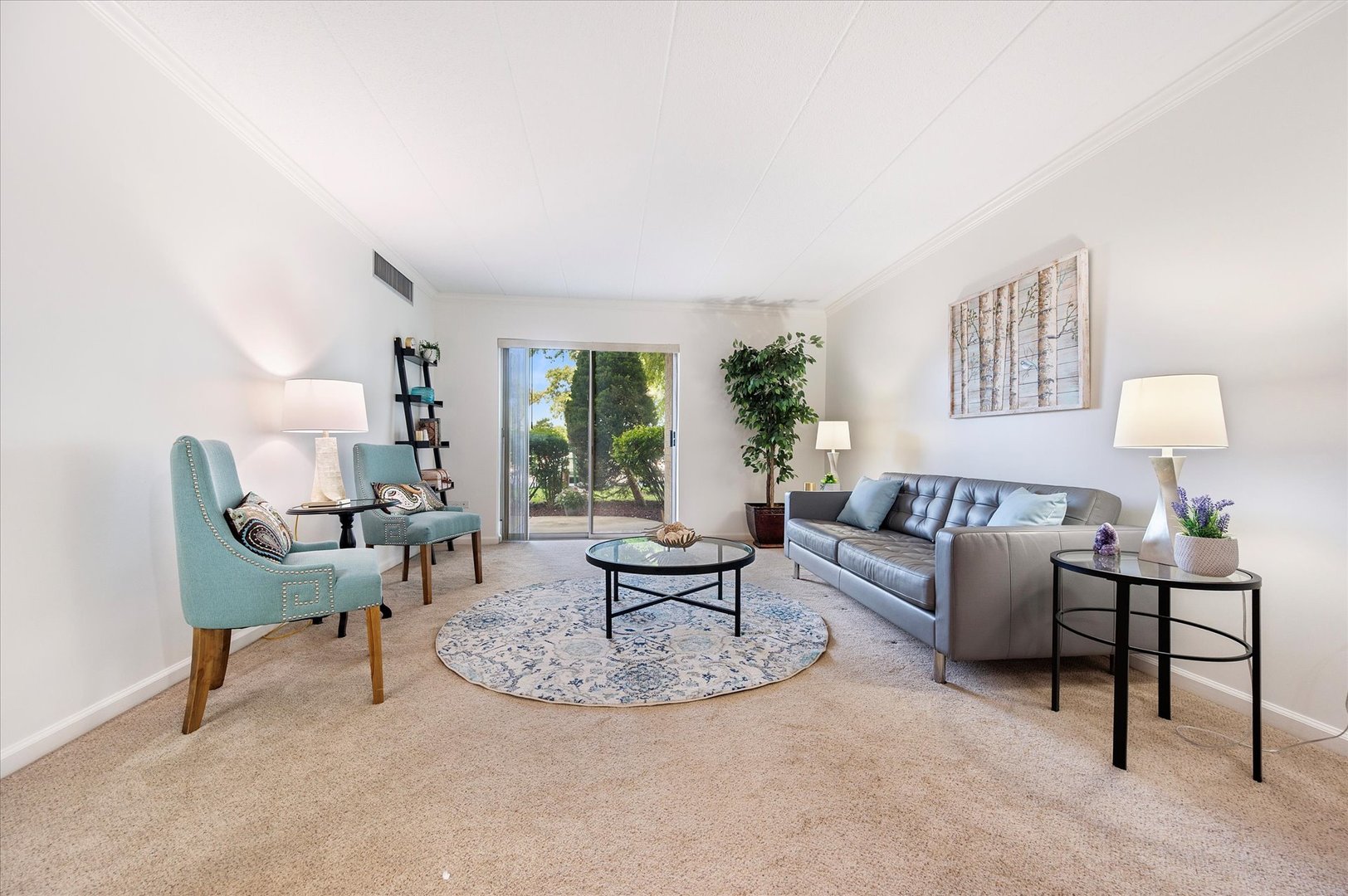 100 West Butterfield Road, Unit 101N Elmhurst, IL 60126 - Photo 3 of 27 a living room with furniture and a large window