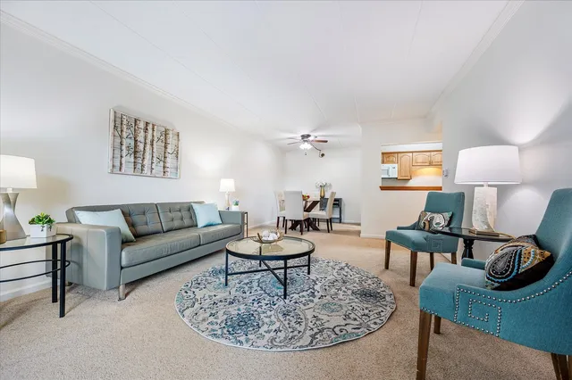 a living room with furniture and a table