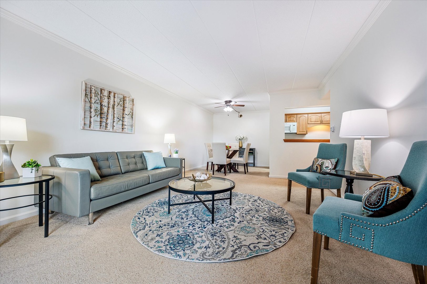 100 West Butterfield Road, Unit 101N Elmhurst, IL 60126 - Photo 4 of 27 a living room with furniture and a table