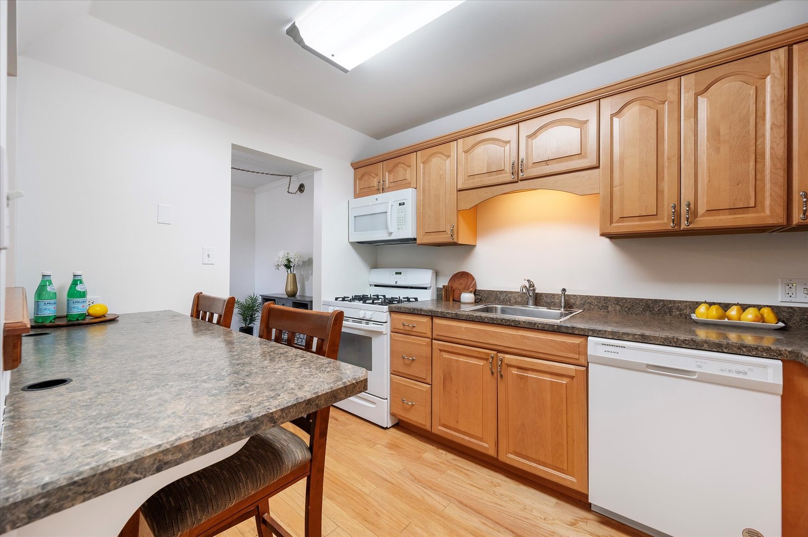 100 West Butterfield Road, Unit 101N Elmhurst, IL 60126 - Photo 8 of 27 a kitchen with appliances cabinets and wooden floor