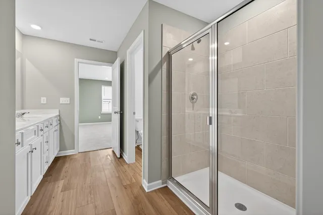 a bathroom with a shower and a tub
