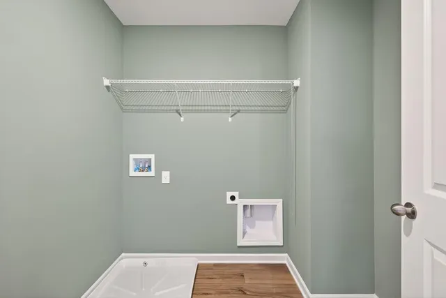 a view of a house with a yard and a garage