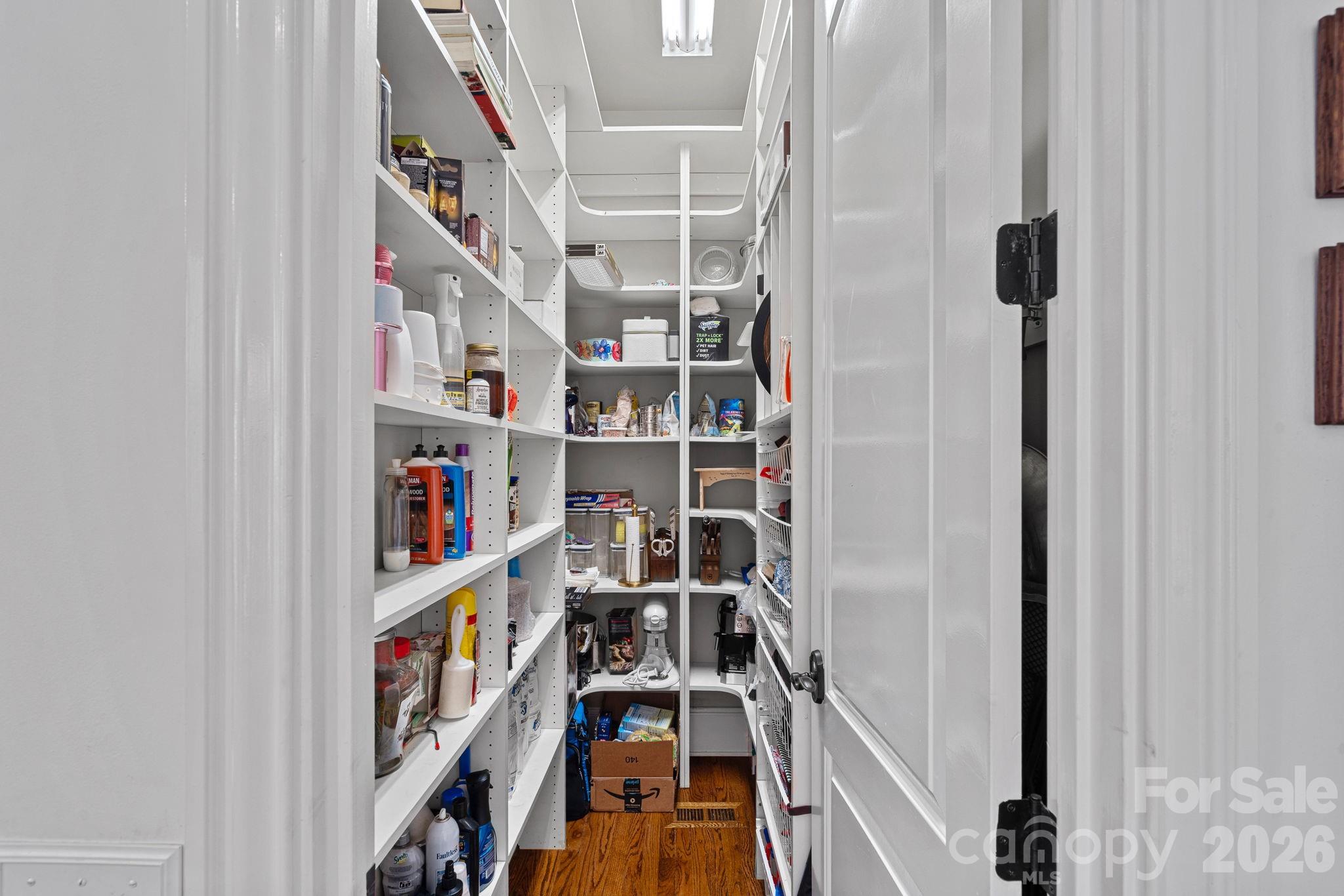 123 Cape Cod Way Mooresville, NC 28117 - Photo 18 of 48 a view of walk in closet with clothes and shoes