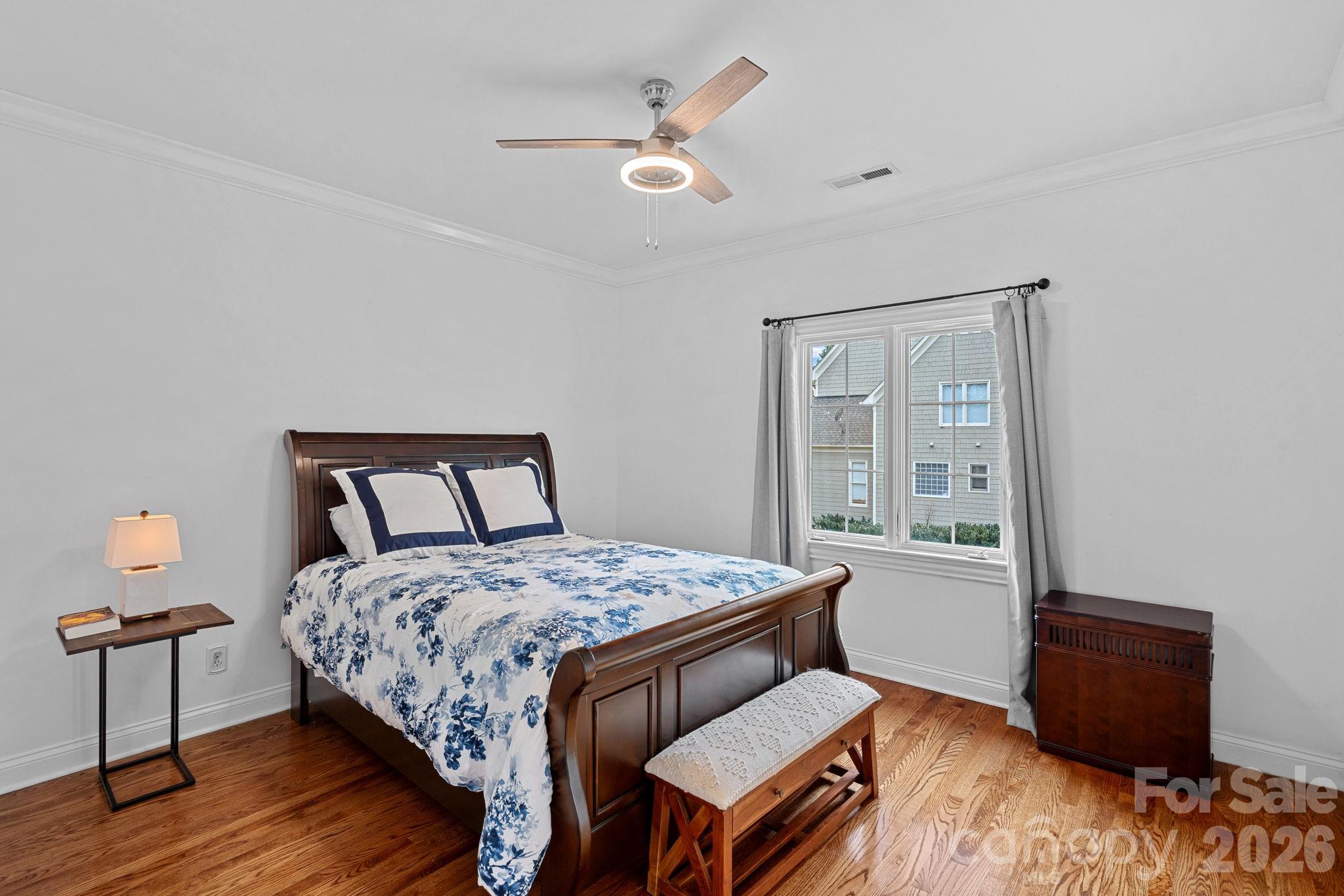 123 Cape Cod Way Mooresville, NC 28117 - Photo 35 of 48 a bedroom with a bed and wooden floor