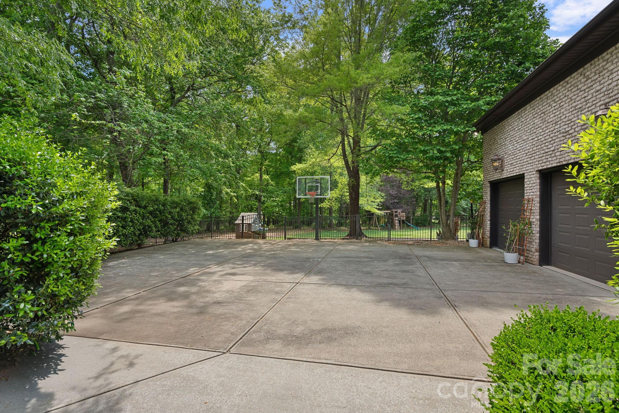 123 Cape Cod Way Mooresville, NC 28117 - Photo 44 of 48 a view of a yard with plants and trees