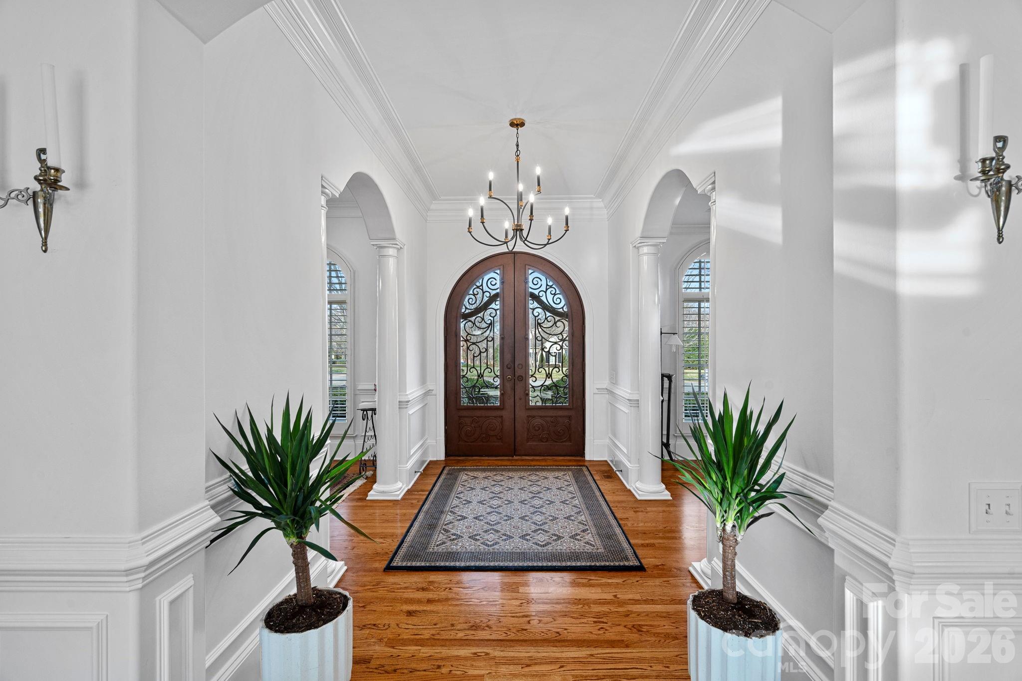 123 Cape Cod Way Mooresville, NC 28117 - Photo 5 of 48 a view of a hallway with potted plant in front of it